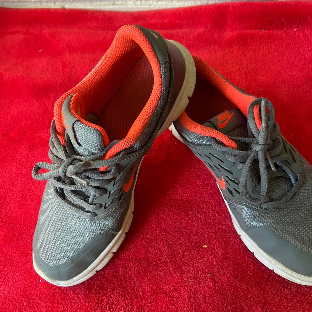 Nike Gray and Orange Sneakers with Modern Silhouette
